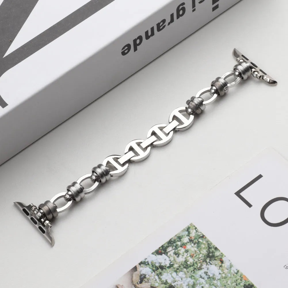 Stainless steel punk chain watch band for Apple Watch in silver finish on a wrist, showing chain links and custom connector