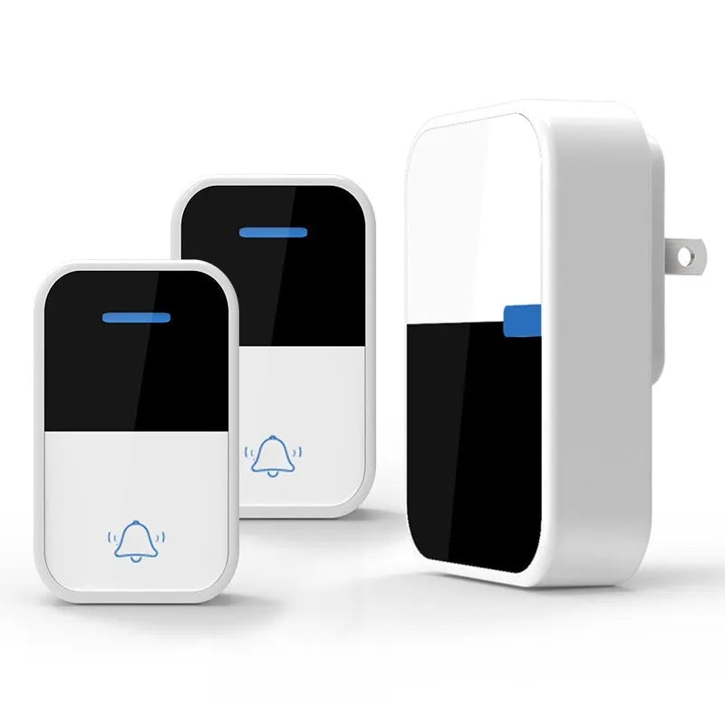 Modern white plastic wireless doorbell receiver and self-generating button unit.