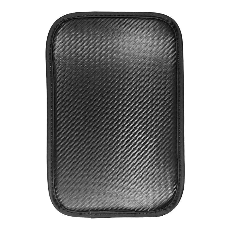 Carbon fibre pattern leather car armrest cushion mat in black, shown on a car centre console.