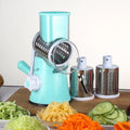 Round mandoline vegetable slicer with three stainless steel blades and suction cup base