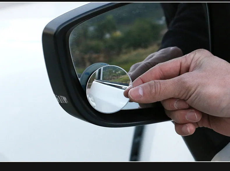 Silver round convex blind spot mirror with adjustable mount for car rearview mirror.