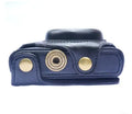Sony RX100M5 camera inside black faux leather holster with soft interior lining and tripod mount access