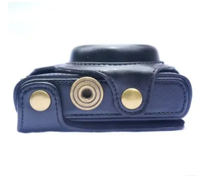Sony RX100M5 camera inside black faux leather holster with soft interior lining and tripod mount access