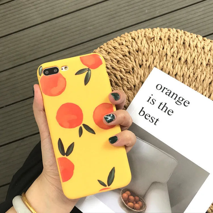 Orange matte finish TPU silicone case for iPhone on a table.