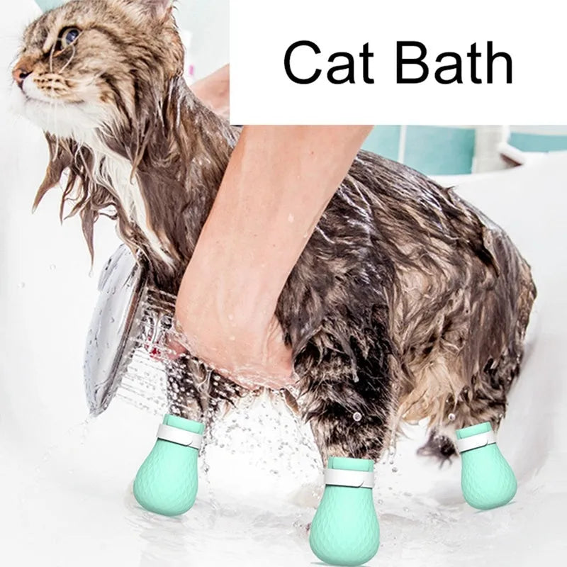 Green silicone cat bathing feet washing set with nylon buckle strap on a surface