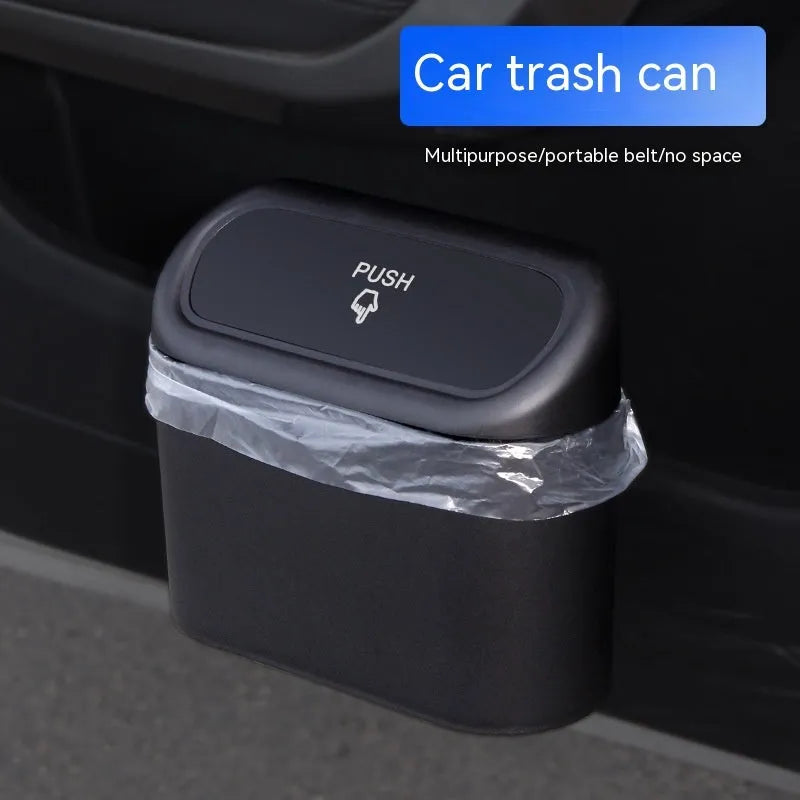 Black foldable plastic car trash can with waterproof lining, designed for mounting behind a car seat.