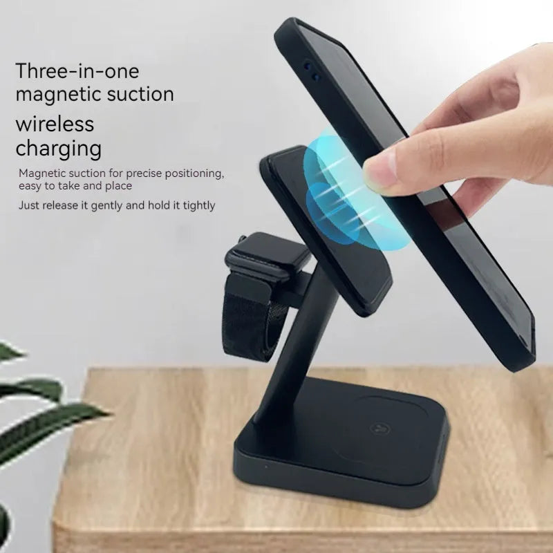 Black cube-shaped three-in-one wireless charging station for mobile phone, watch, and earbuds.