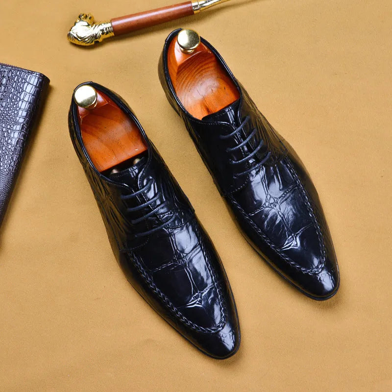 Men's black cowhide alligator pattern leather shoes with horse bit buckle, pointed toe, and rubber sole on a white background