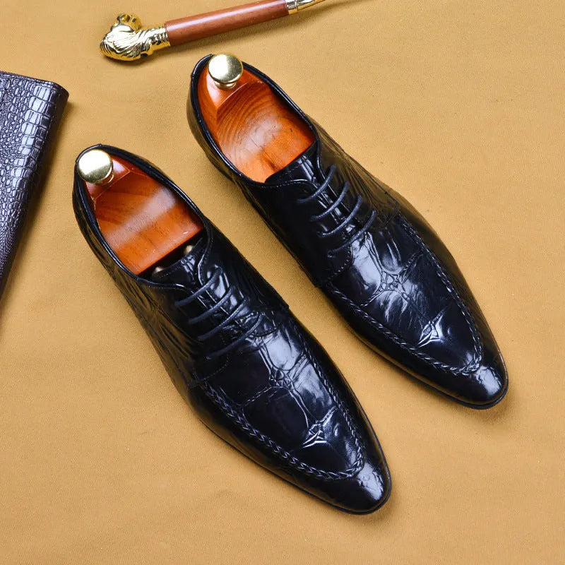 Men's black cowhide alligator pattern leather shoes with horse bit buckle, pointed toe, and rubber sole on a white background