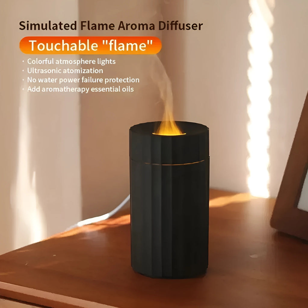 Black and white flame effect essential oil diffuser and air humidifier with coloured LED lights on a wooden table.