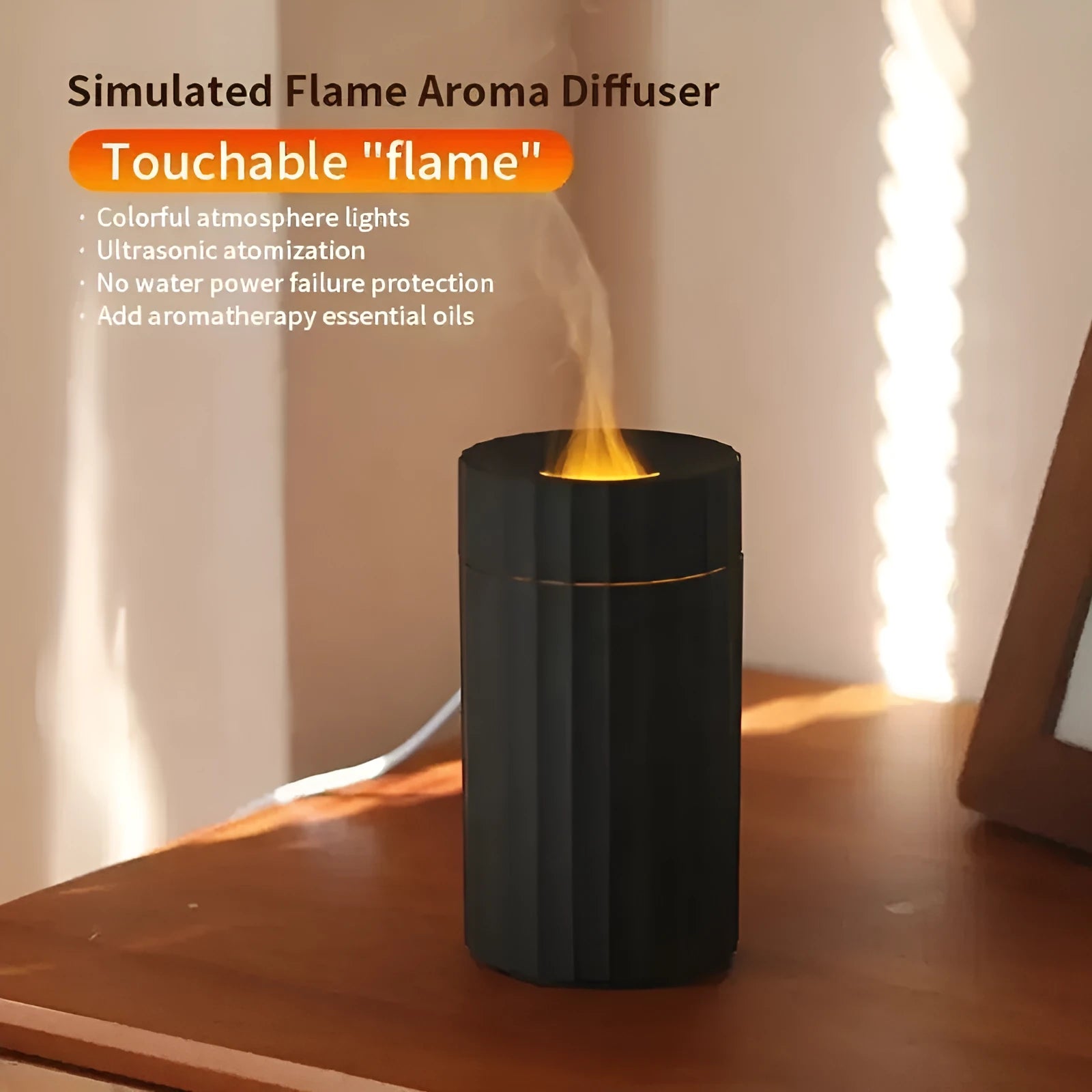 Black and white flame effect essential oil diffuser and air humidifier with coloured LED lights on a wooden table.