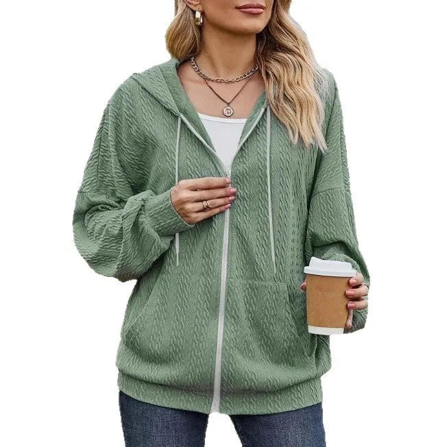 Green women's hooded zip-up coat with loose fit and long sleeves
