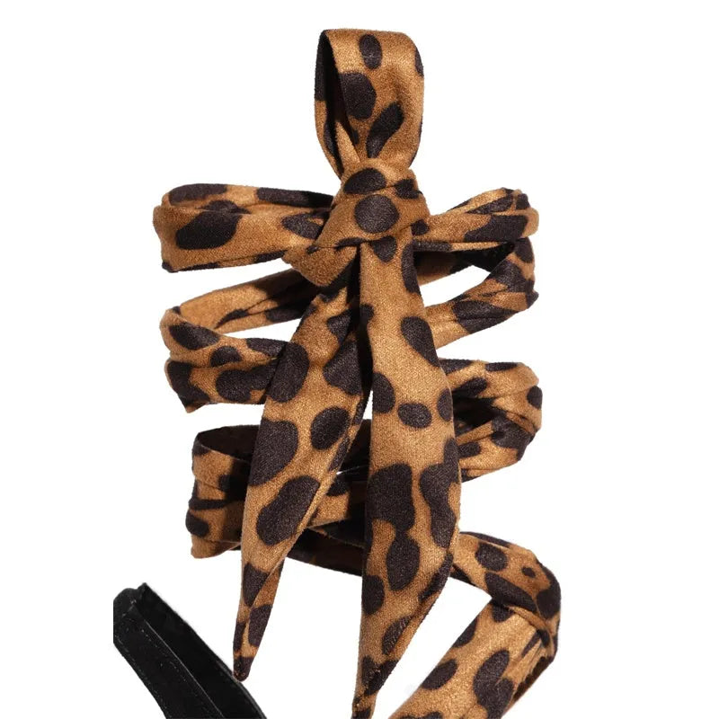 Light brown leopard print women's high heels with Roman cross straps and super high thin heels