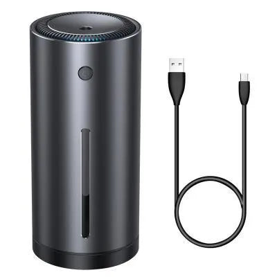 Black aluminium car humidifier and air purifier unit with USB cable on a car dashboard.