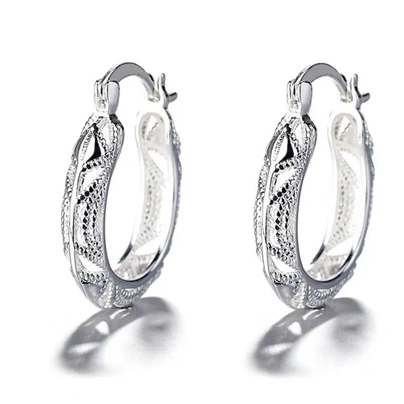 Geometric metal earrings for women with electroplated silver finish, individually packed.