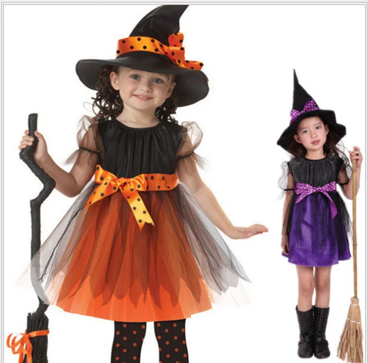 Child wearing a linen witch costume for fancy dress, available in bat, broom, purple and yellow designs.