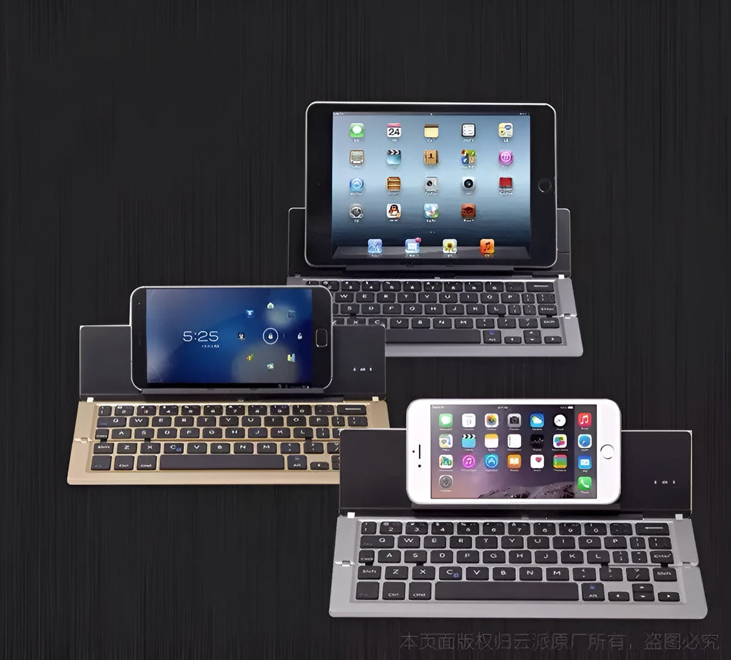 Slim aluminium folding wireless Bluetooth keyboard in four colours, expanded for typing on a flat surface
