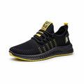 Men's black casual sports shoes with three white stripes and cross-strap detail on the Flying Weave upper.