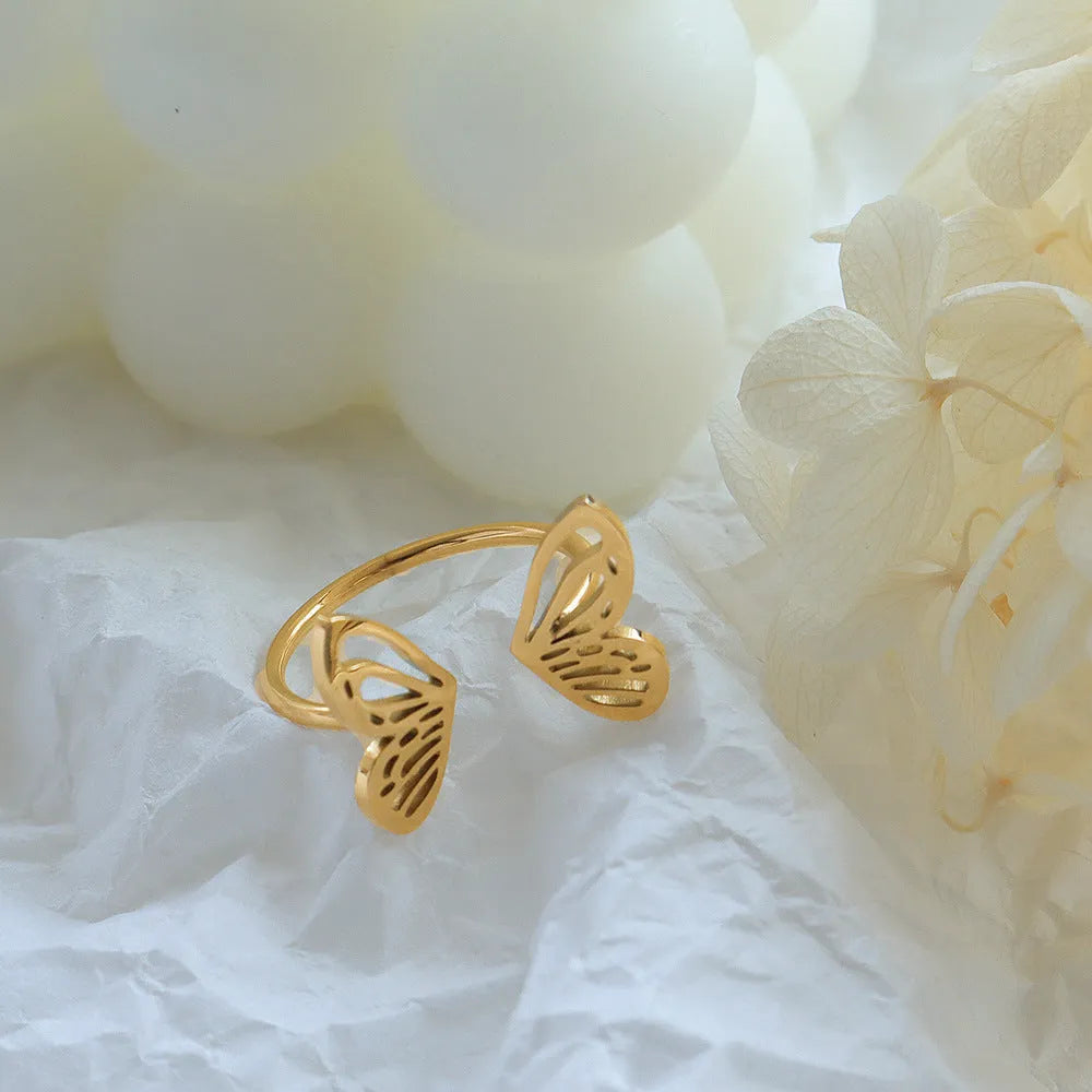 Titanium steel hollow butterfly ring with adjustable opening in gold colour