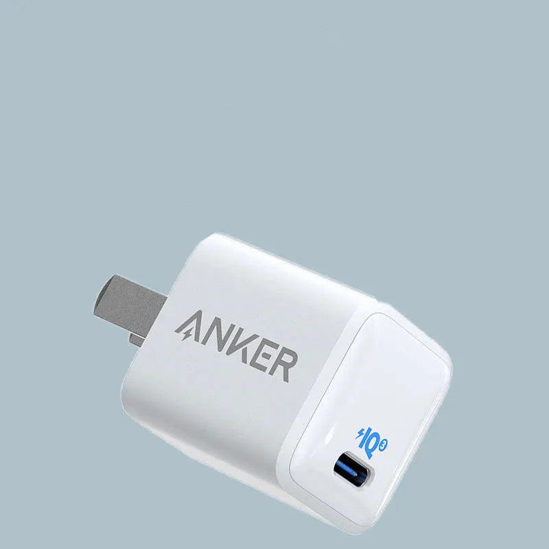 White 18W fast travel USB charger with a UK plug.