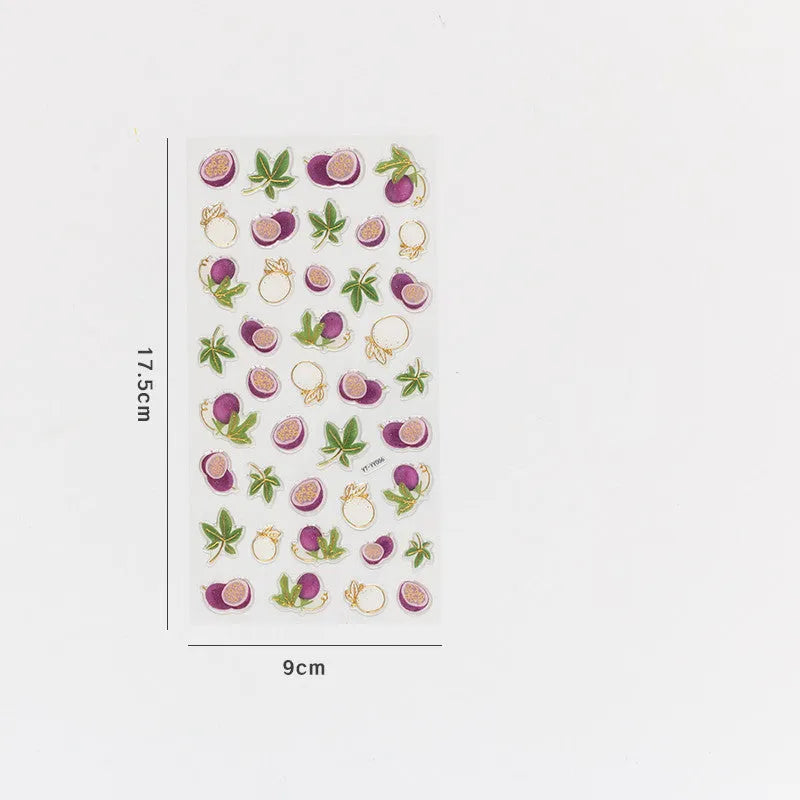 Sheet of six DIY fruit bronzing stickers showing grape, orange, passion fruit, peach, pineapple and strawberry designs.