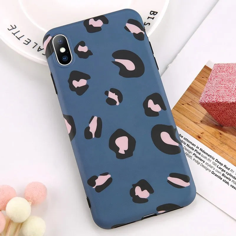 Leopard print mobile phone case for iPhone in black, blue, and pink colours
