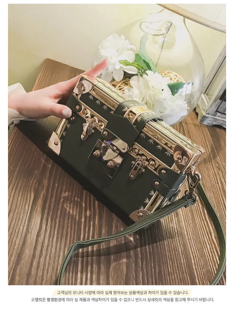 Women's hard-sided black PU leather flap shoulder bag with rivet decoration and hasp closure