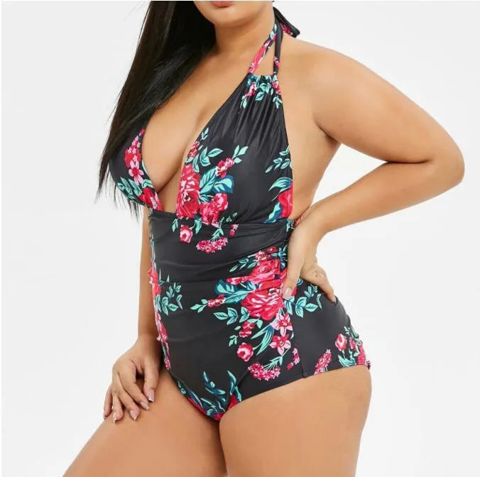 Printed black one-piece swimsuit made from polyester fibre, full coverage design, available in sizes XL to 5XL