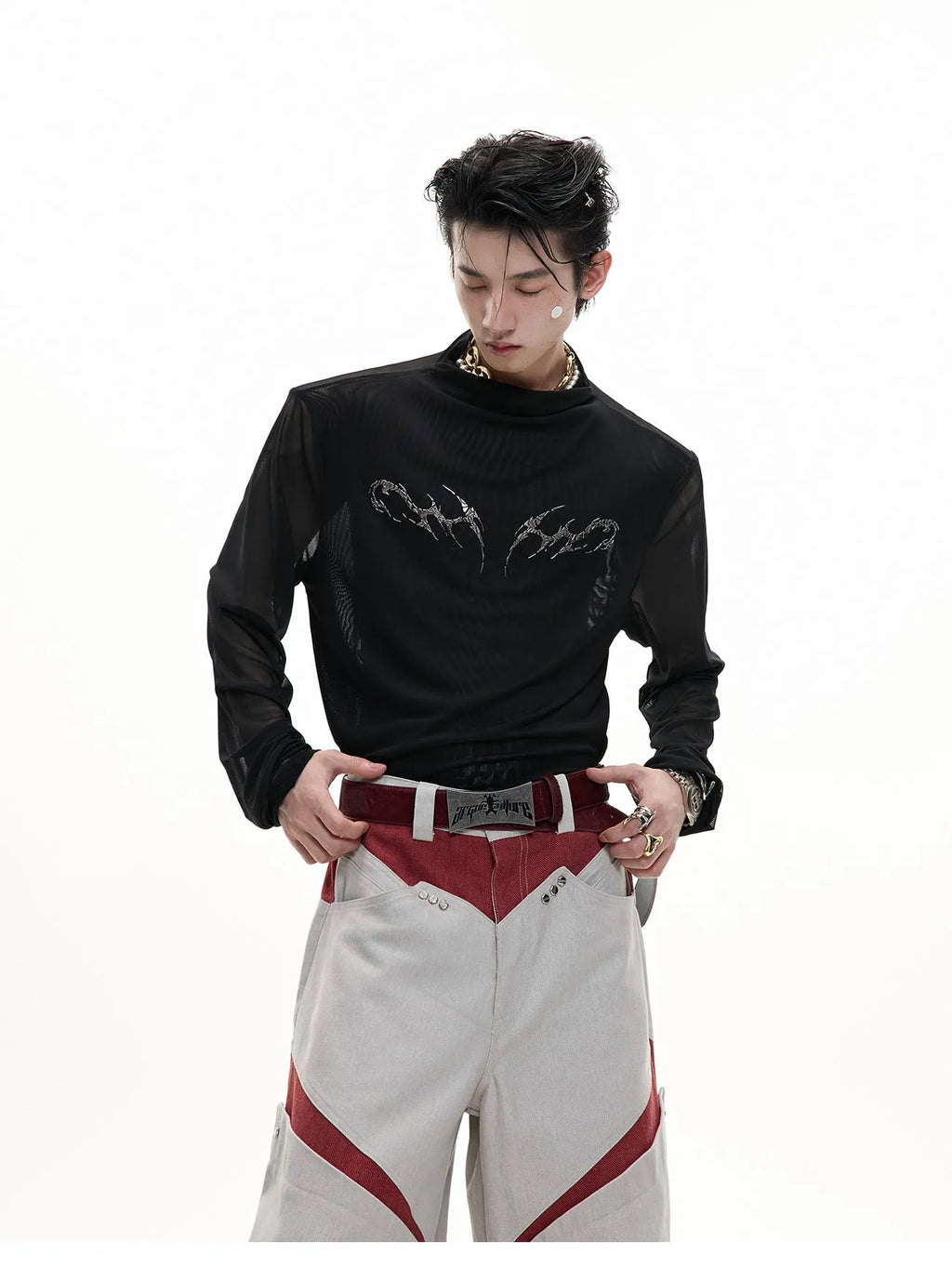 Slim-fit long-sleeved mesh shirt in black, shown as a base layer for athletic wear.