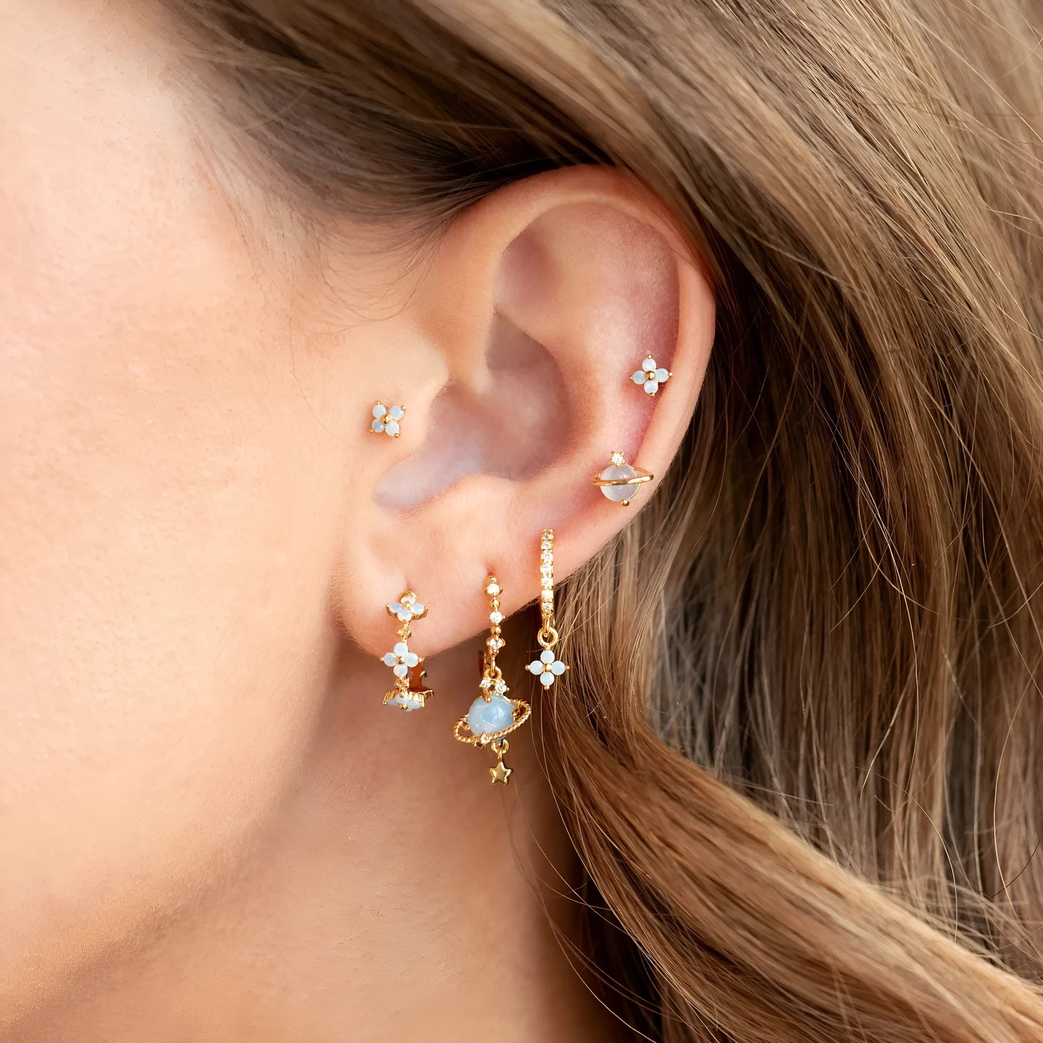 Blue protein colour flower nail design earrings with zircon accents in gold and silver options