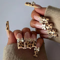 Leopard print butterfly design plastic nail art pieces in colour WM296