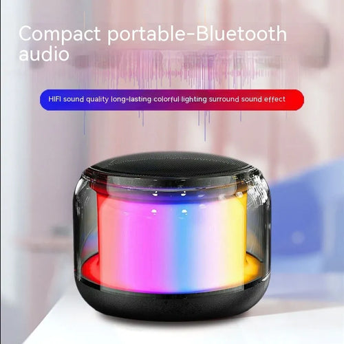 Black gun-shaped Bluetooth speaker with coloured glaze finish and card insertion slot