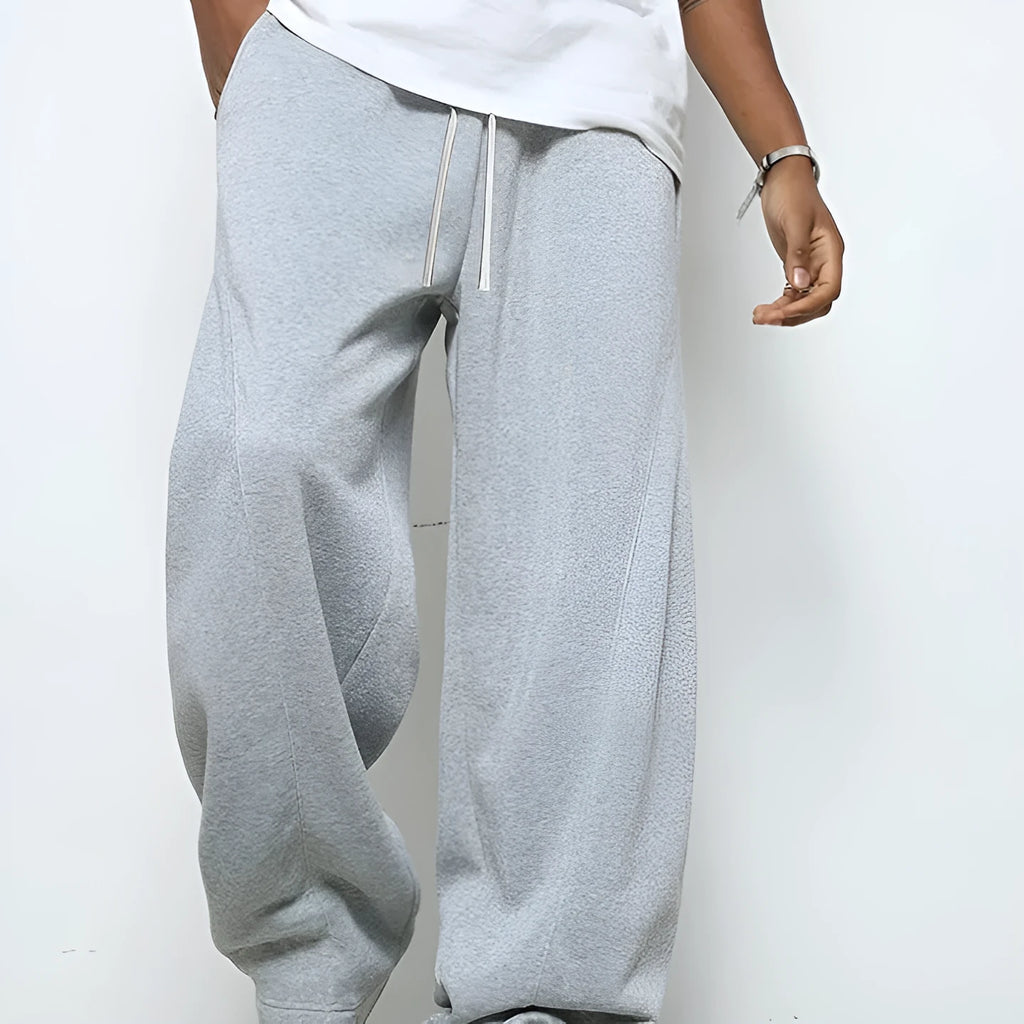 Men's straight-leg casual trousers in black with a micro-elastic drawstring waistband.
