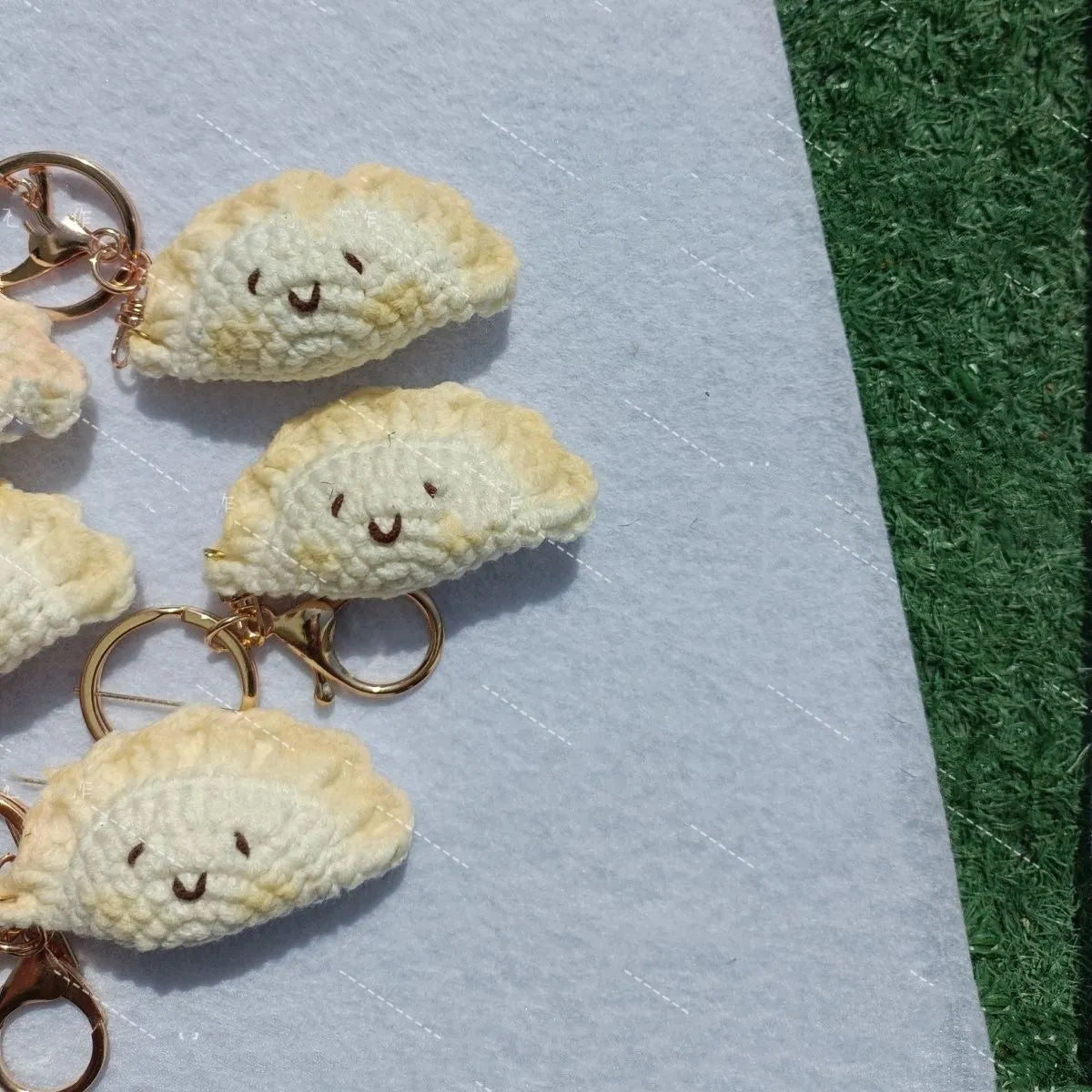 Handmade crochet dumpling pendant with plush texture and keychain in traditional festival design