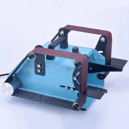 Blue desktop dual-axis belt sander with a 40x680mm abrasive belt, variable speed control, and compact design.