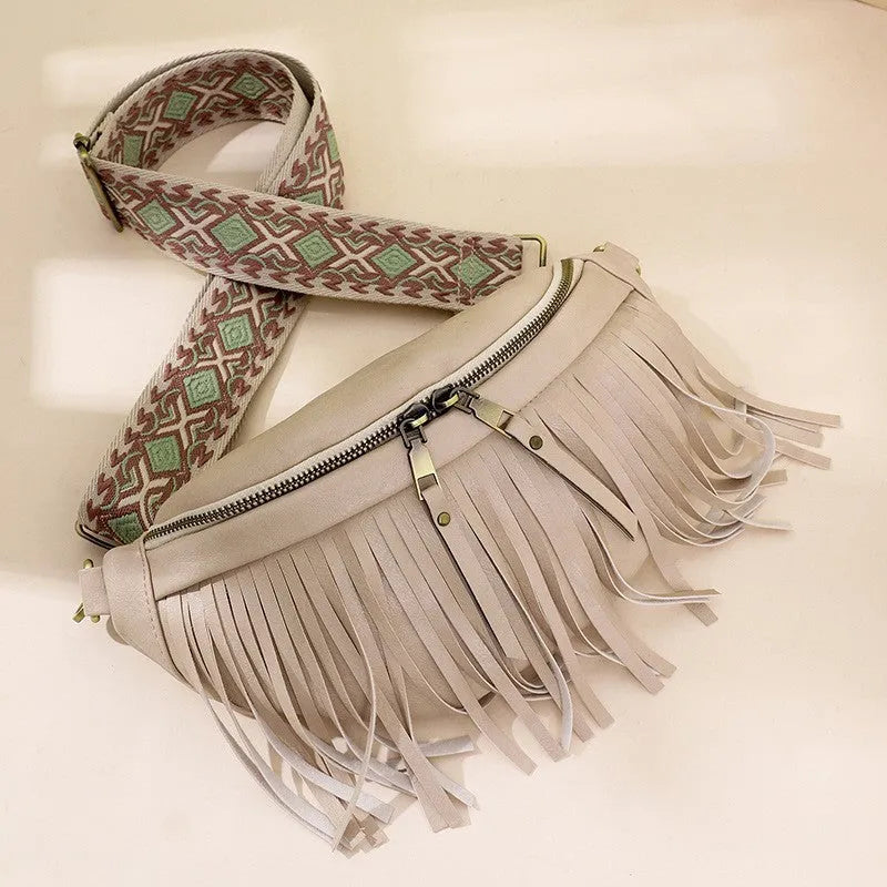 Retro-style pleated messenger crossbody bag in PU leather with a tassel, shown in macaron-gray.