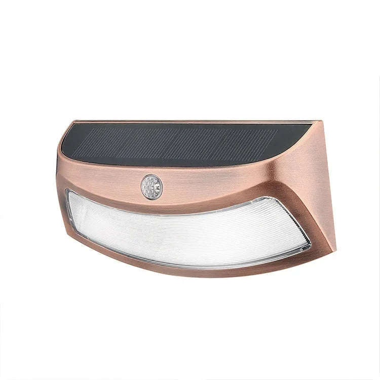 Solar-powered outdoor wall lamp with smiling face design for garden or courtyard lighting.