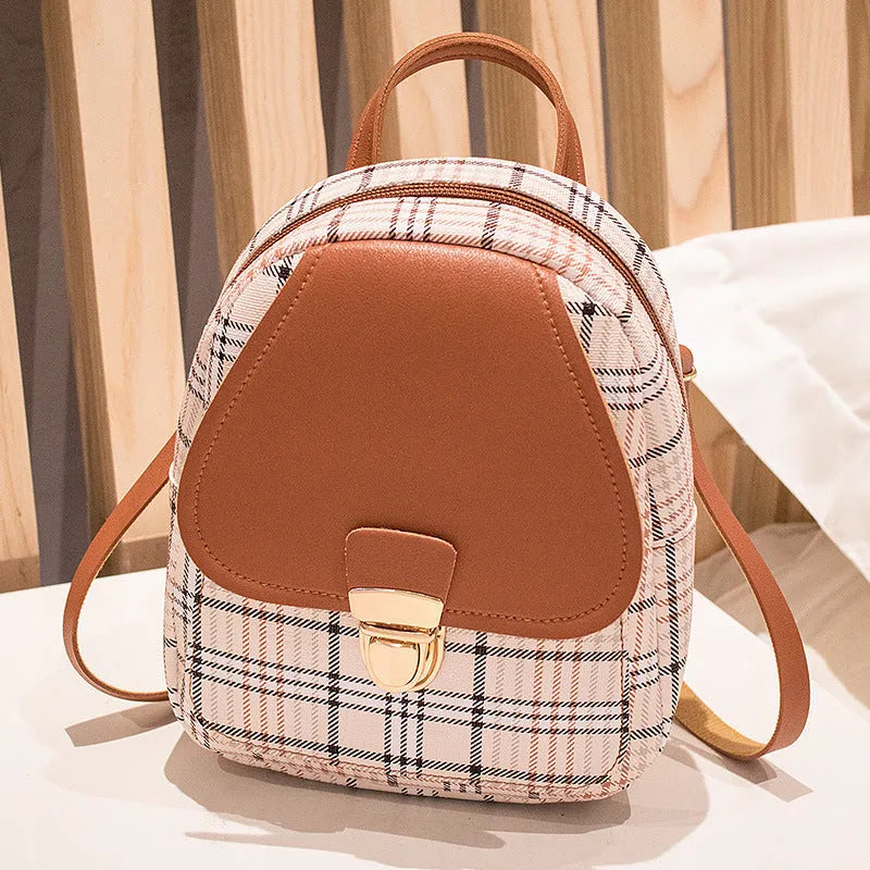 A diagonal one shoulder phone bag in synthetic PU leather, shown in a colour selection.