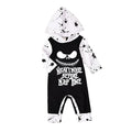 Halloween romper in black cotton with long sleeves and attached hood, shown on a neutral mannequin