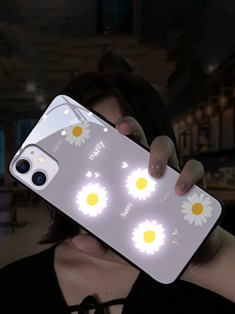 White luminous iPhone case with painted purple daisy design and voice-activated colour light.