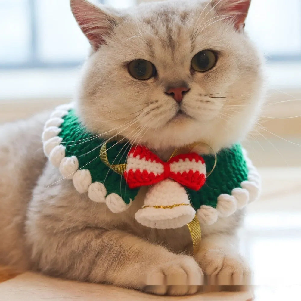 Knitted wool Christmas scarf for pets featuring festive patterns like striped Santa and elk, shown attached to a dog collar.