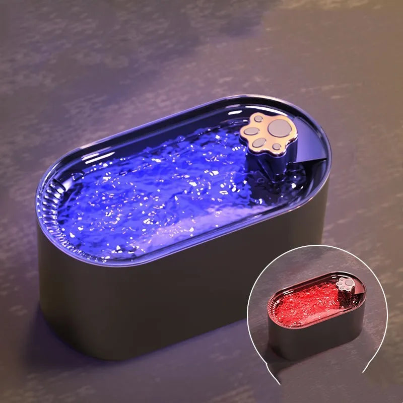 Berlin blue automatic pet water fountain with triple filter and LED light on a wooden floor.