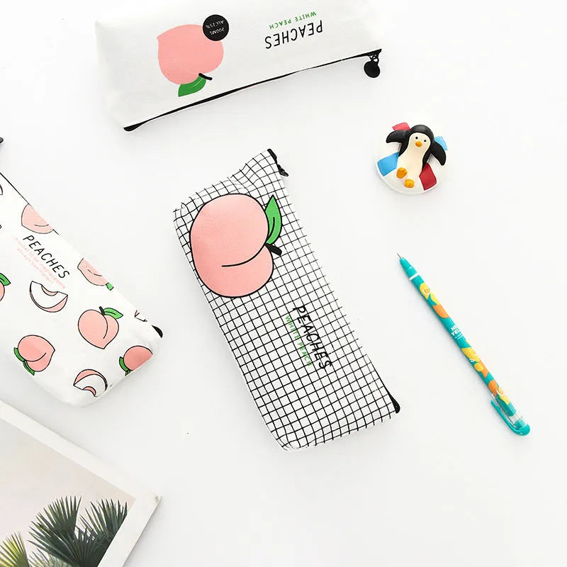 Rectangular canvas pen bag in peach print pattern, 20 by 8.5 centimetres, on a flat surface.