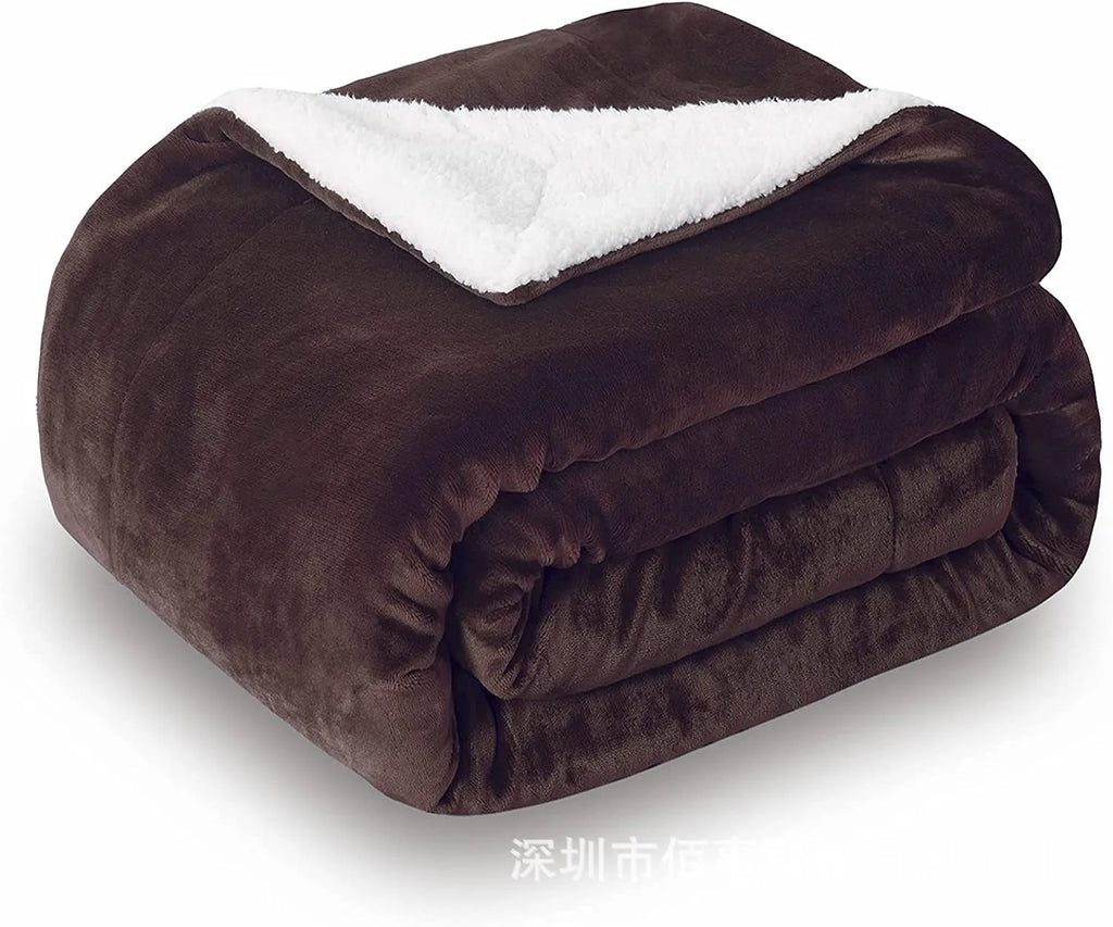 Grey and white USB electric heating blanket with intelligent temperature control on a desk.