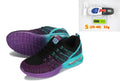 Women's casual running shoes with lace-up front, mesh lining, and flat heel in black