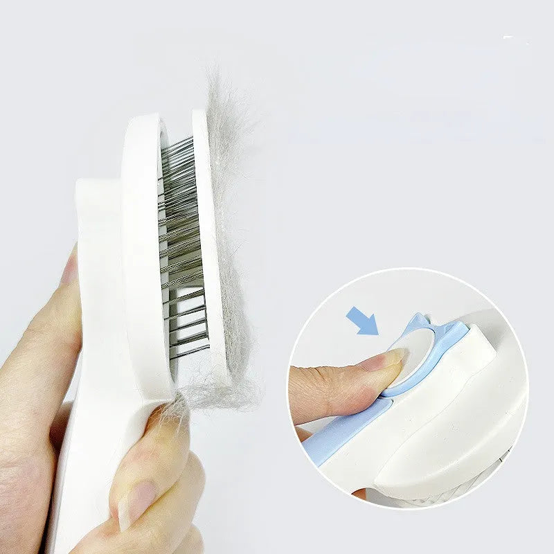 Self-cleaning pet grooming brush with stainless steel bristles and round massage beads for dogs and cats