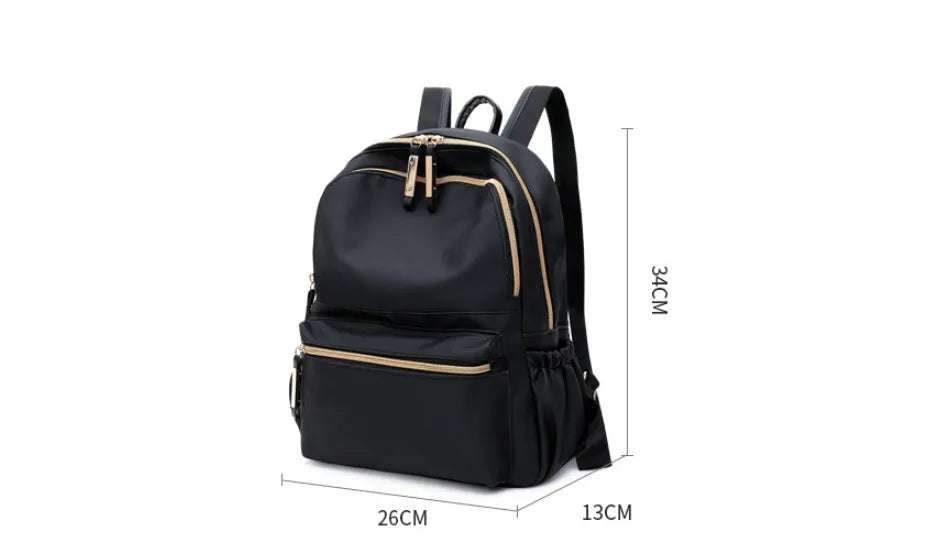 Black waterproof Oxford cloth backpack for women, 34x26x13cm, with two straps and front pocket on plain background