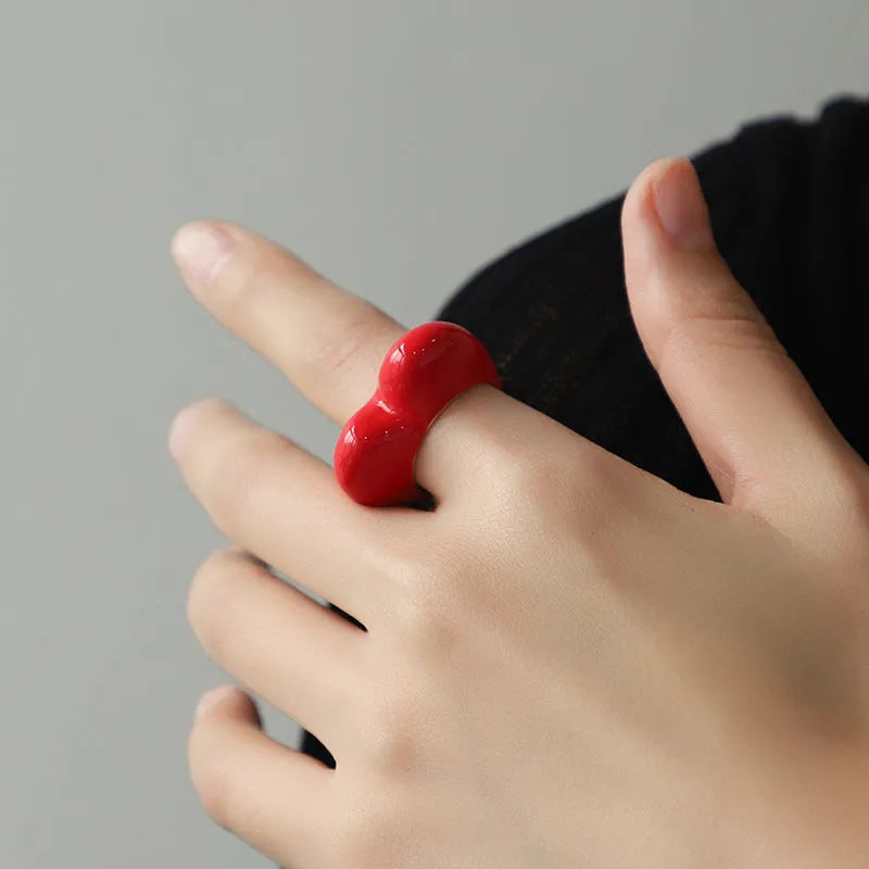 Three-dimensional enamel heart ring in zinc alloy showing raised design detail