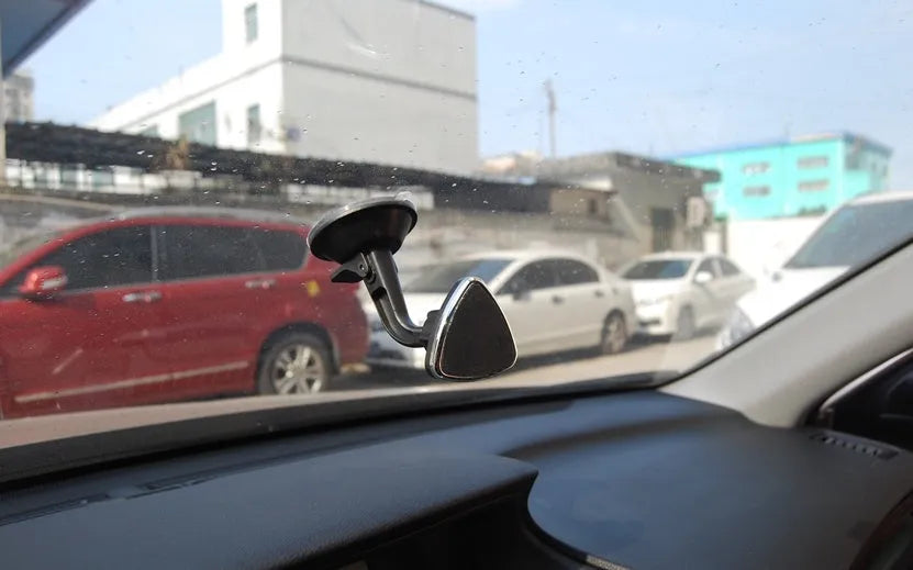 Black magnetic car phone holder with 360 rotation for dashboard mounting with iPhone and Samsung compatibility