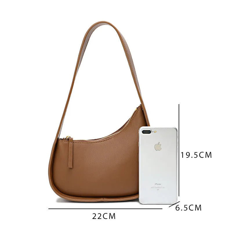 Genuine leather ladies shoulder bag with half moon design and wide strap